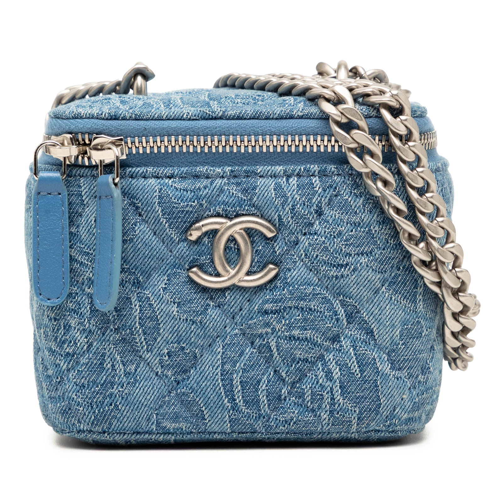 Chanel Camellia Sweetheart Mini Denim Vanity Crossbody Chain Bag: Chanel Camellia Sweetheart Mini Denim Vanity Crossbody Chain Bag A Chanel mini vanity case crossbody bag in blue quilted denim with a camellia sweetheart design. It features a curb chain strap, zip-ar