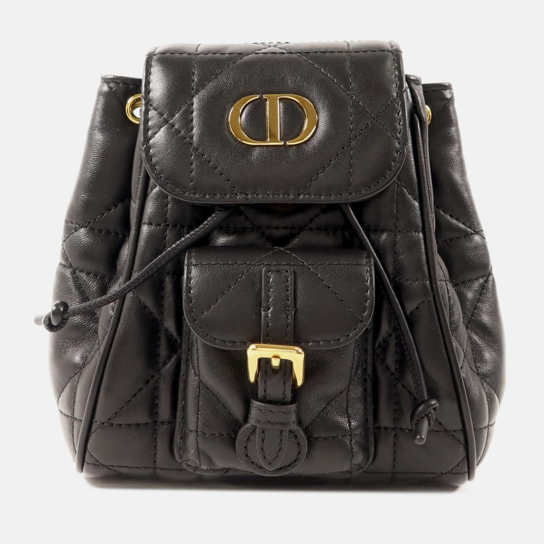 Dior Caro Nano Lambskin Backpack Black with CD gold tone hardware: Dior Caro Nano Lambskin Backpack Black with CD gold tone hardware A Christian Dior Caro Nano Backpack Rucksack in black lambskin leather. This compact bag features a magnetic pocket, one exterior magn