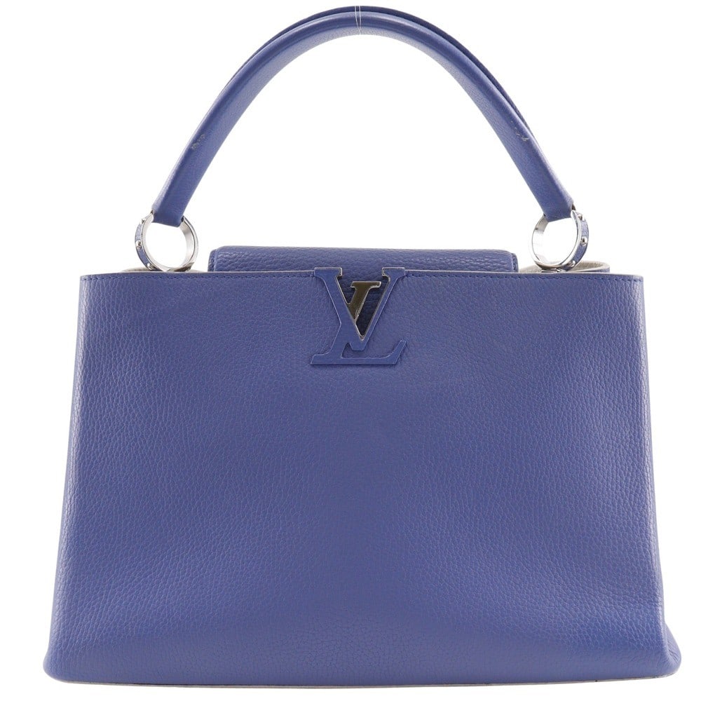 Blue Leather Louis Vuitton Capucines Handbag 35.5cm by 23cm by 13.5cm: Blue Leather Louis Vuitton Capucines Handbag 35.5cm by 23cm by 13.5cm This Louis Vuitton Capucines bag is crafted from blue leather, designed for women. The bag features a spacious interior and