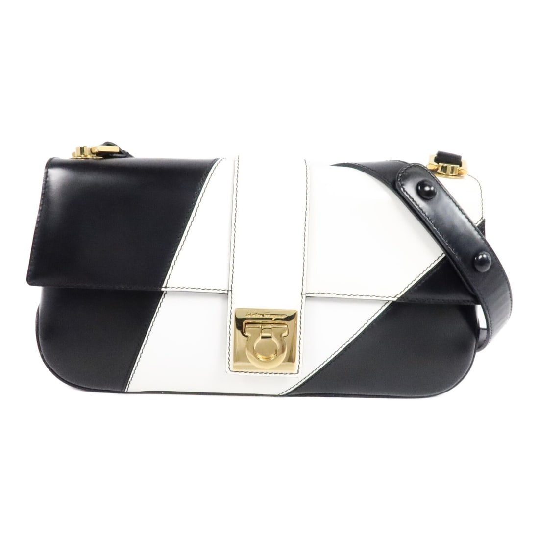Salvatore Ferragamo Calfskin Shoulder Bag Black White Gold Tone: Salvatore Ferragamo Calfskin Shoulder Bag Black White Gold Tone Salvatore Ferragamo shoulder bag in black and white calfskin leather with a shoulder strap and one interior zip pocket. Made in Italy, t