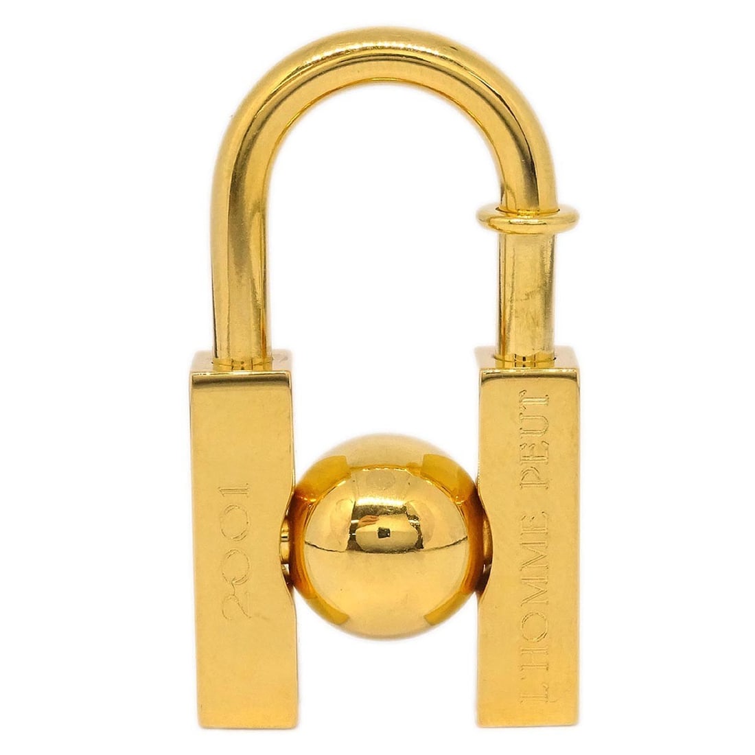 Gold Plated LHomme Peut Embellir La Terre Cadena Bag Charm by Hermes: Gold Plated LHomme Peut Embellir La Terre Cadena Bag Charm by Hermes This Hermes LHomme Peut Embellir La Terre Cadena Lock Charm is crafted from gold-plated metal and features a striking gold color. D