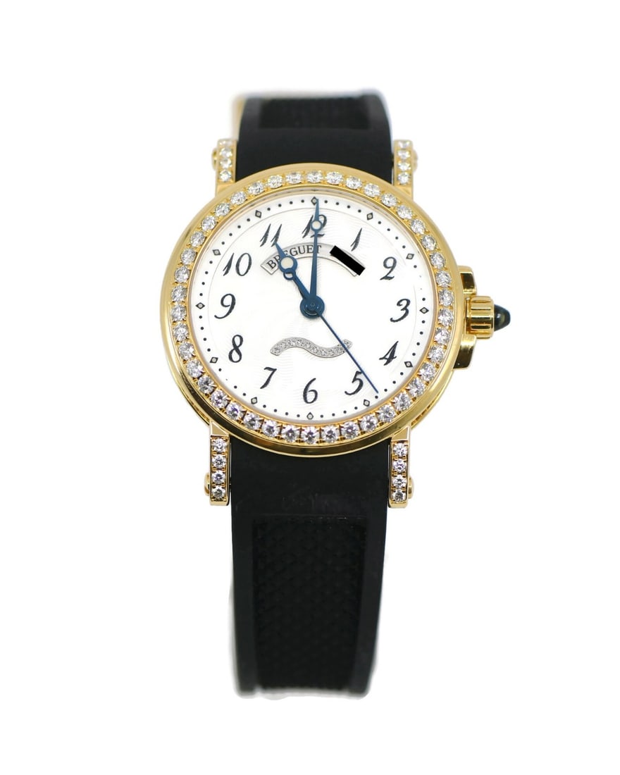 Breguet Marine 18K Yellow Gold Diamond Bezel Wristwatch: Breguet Marine 18K Yellow Gold Diamond Bezel Wristwatch This Breguet Marine wristwatch features a polished 18K yellow gold case with a diameter of 30mm, complemented by a black rubber two-piece strap.