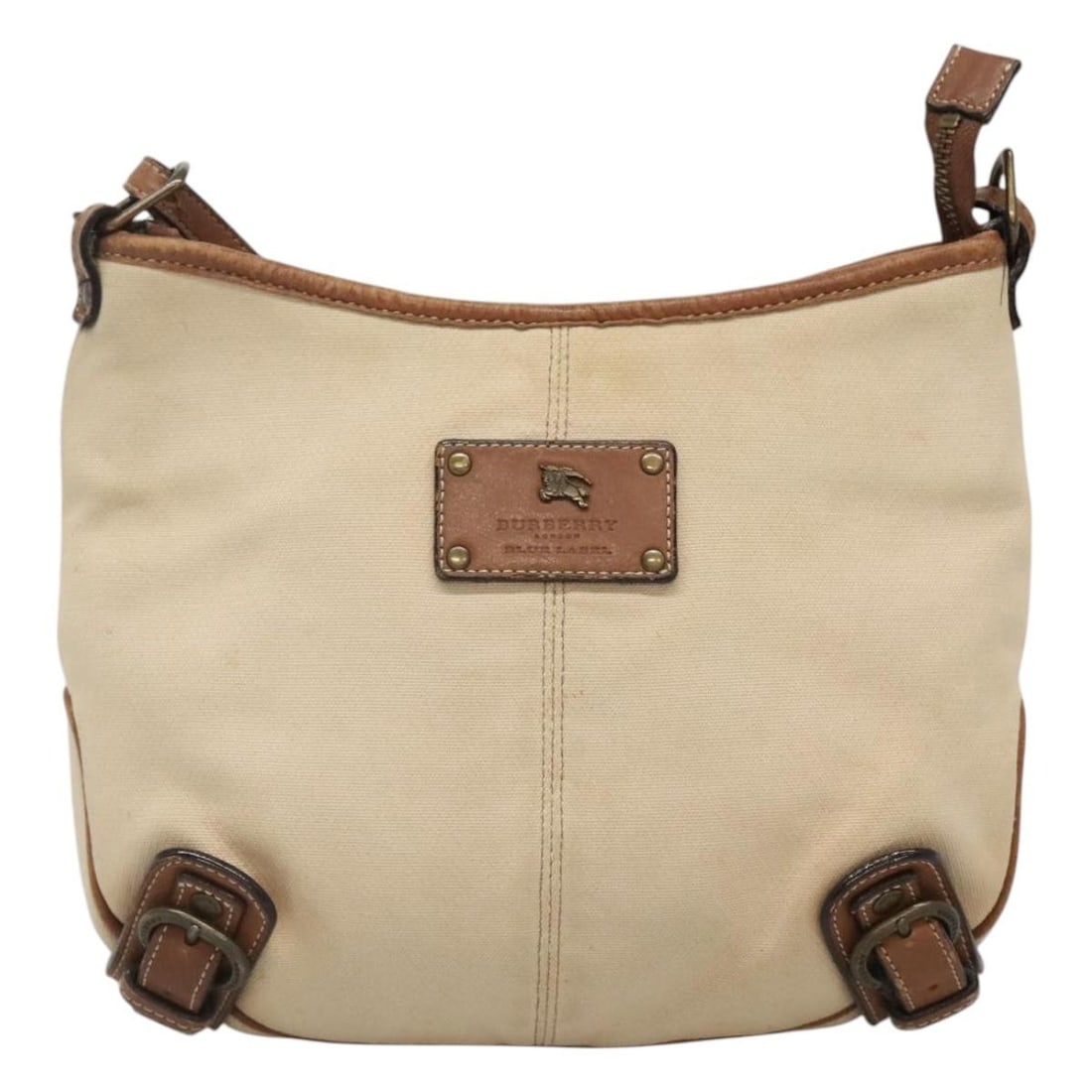 Burberry Blue Label Beige Canvas Shoulder Bag: Burberry Blue Label Beige Canvas Shoulder Bag This Burberry Blue Label shoulder bag is crafted from beige canvas and designed for women. The bag features a compact silhouette and includes a shoulder s
