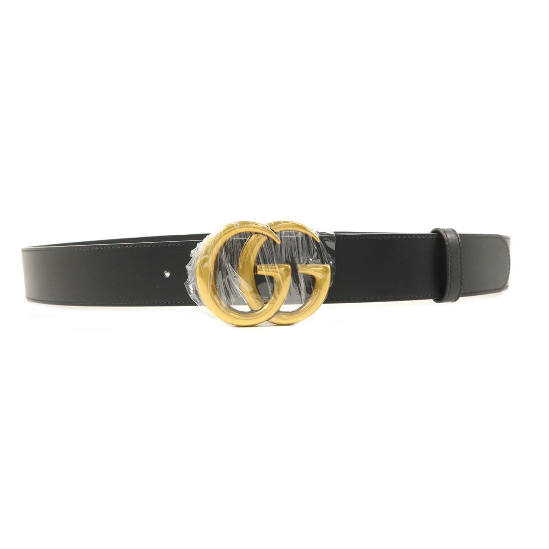 GUCCI 397660 calfskin belt black with GG hardware: GUCCI 397660 calfskin belt black with GG hardware A black GUCCI GG belt crafted from calfskin leather with gold-tone hardware. It is identified as model 397660 and includes a storage bag. The belt is 