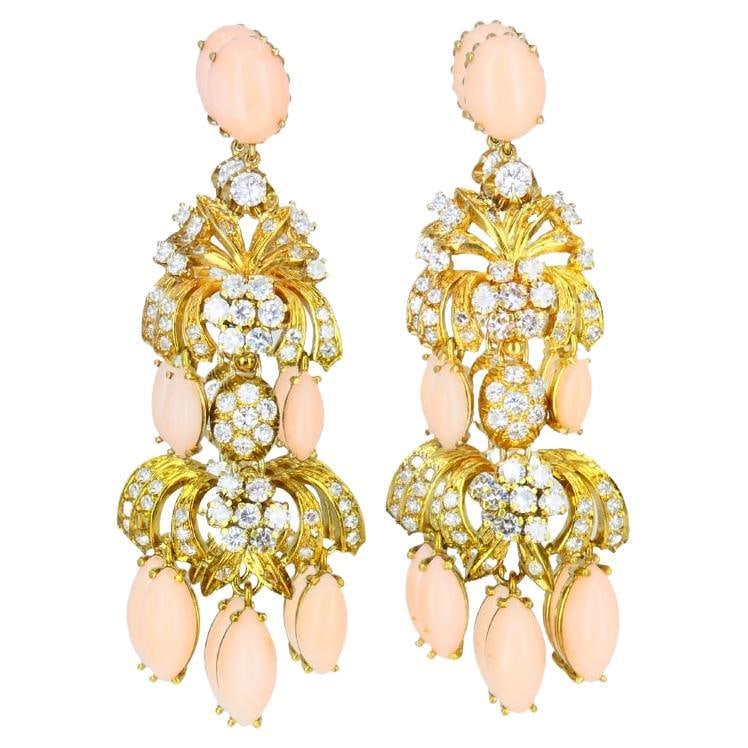 18k Yellow Gold Angel Skin Coral Diamond Dangle Earrings Pair: 18k Yellow Gold Angel Skin Coral Diamond Dangle Earrings Pair Vintage dangle earrings in 18k yellow gold with angel skin coral and diamonds. The design features an ornate, multi-tiered vertical arrang