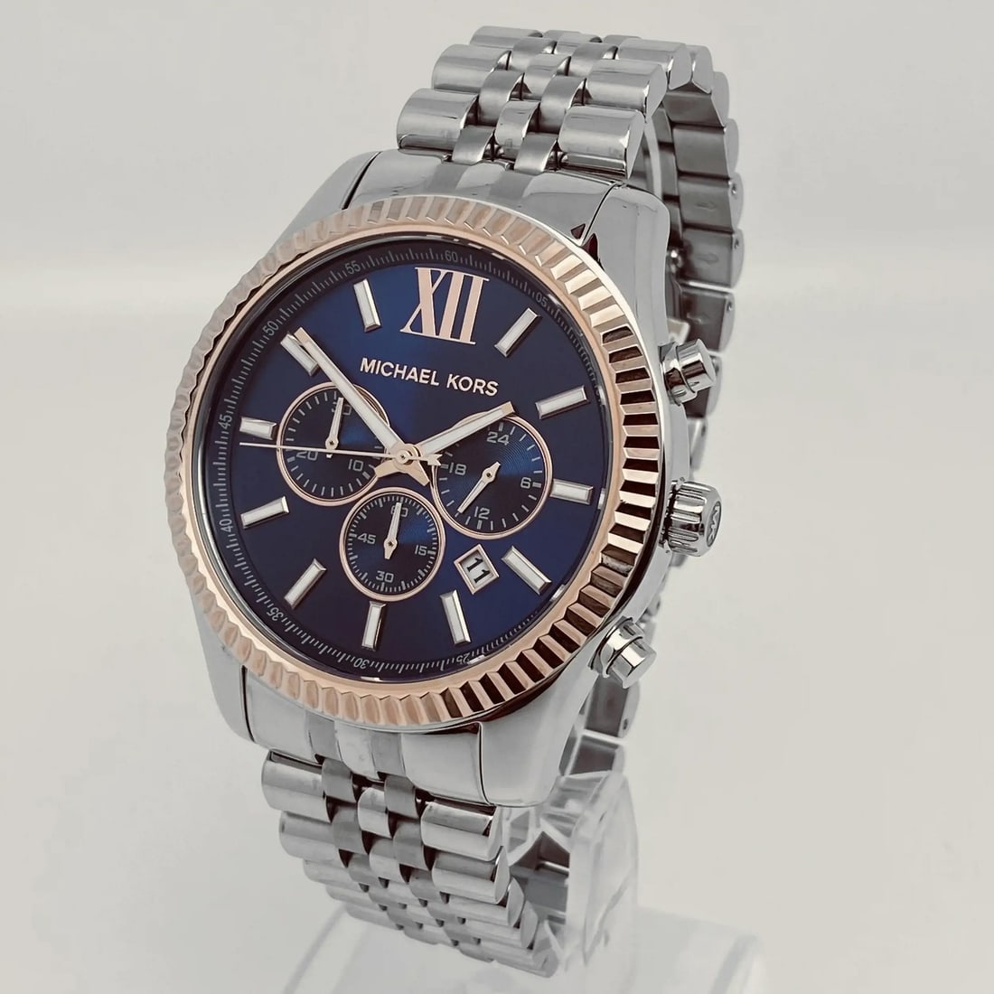 Michael Kors Lexington 42mm Chronograph Blue Dial Men's Watch MK8689: Michael Kors Lexington 42mm Chronograph Blue Dial Men's Watch MK8689 The Michael Kors Lexington 42mm Steel Chronograph Watch is an elegant timepiece designed for men, featuring a striking blue dial an