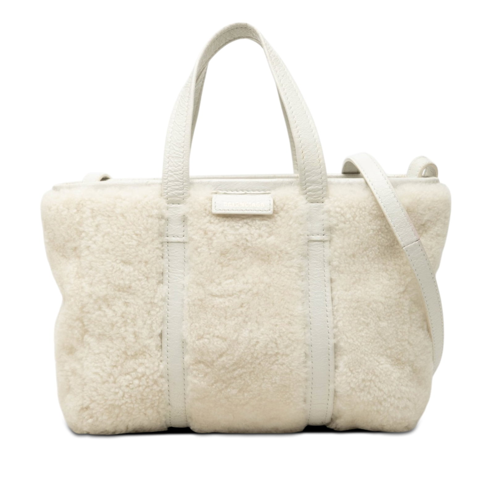 Balenciaga Barbes East West Shopper Tote Small Shearling Leather: Balenciaga Barbes East West Shopper Tote Small Shearling Leather A Balenciaga small shopper tote in shearling and leather, made in Italy. It features flat leather handles, a detachable and adjustable 