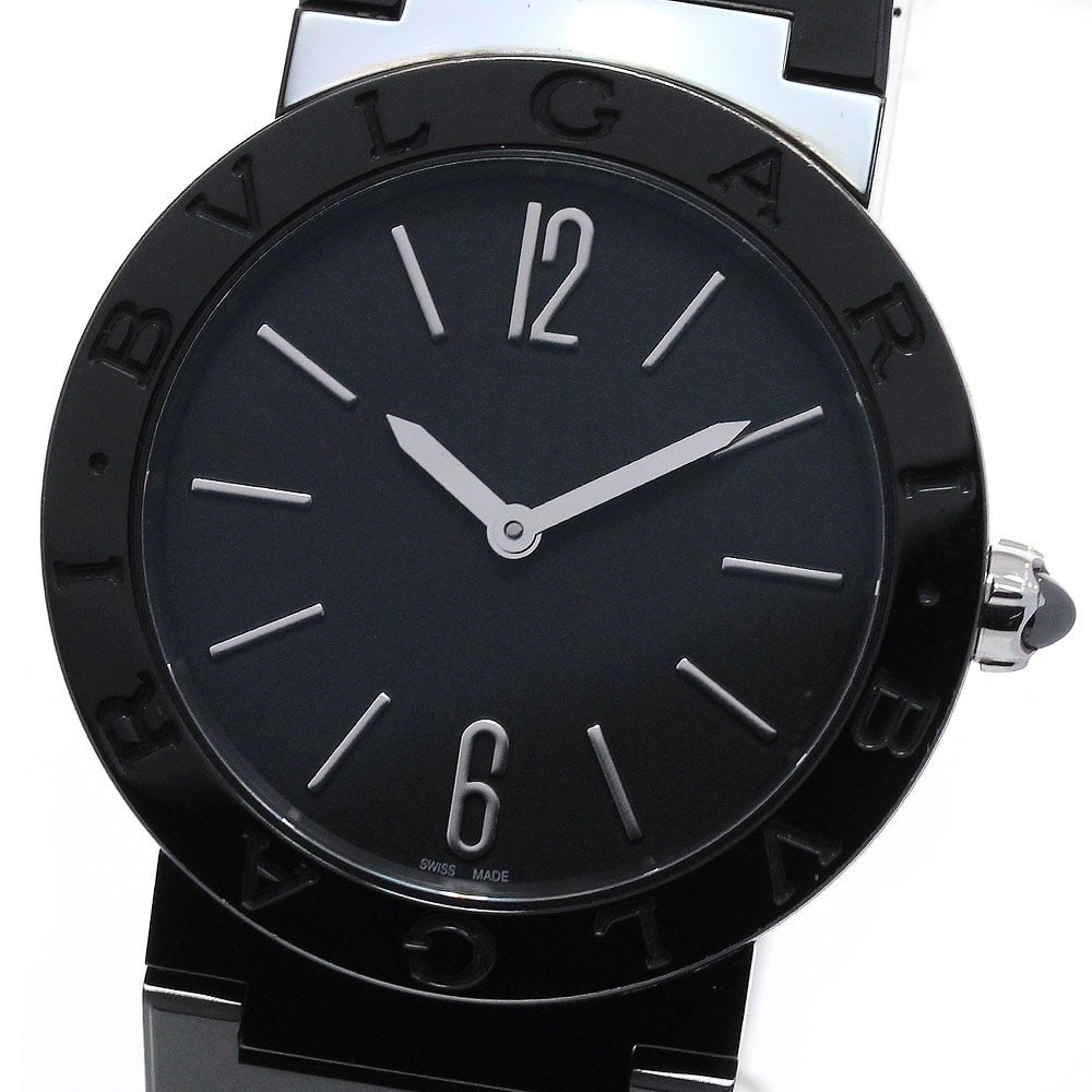 BVLGARI BB33S 103557 mens quartz wristwatch black dial DLC coated: BVLGARI BB33S 103557 mens quartz wristwatch black dial DLC coated Pre-owned BVLGARI BVLGARI men's wristwatch with a black dial and quartz movement. The watch features a DLC-coated stainless steel case