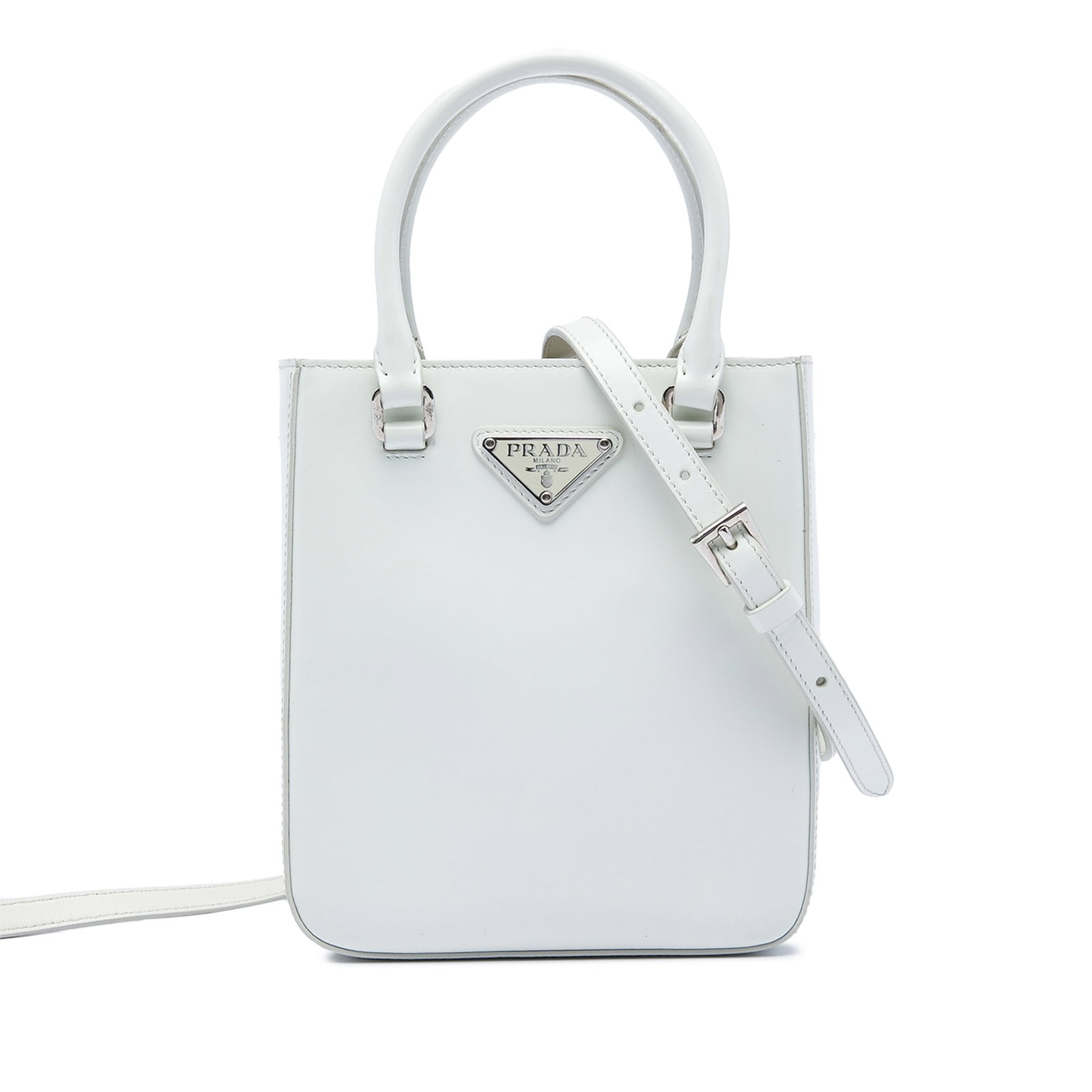 Prada Small Spazzolato Satchel in White Brushed Leather: Prada Small Spazzolato Satchel in White Brushed Leather Small Prada satchel crafted in brushed leather with rolled leather handles and a detachable, adjustable flat leather strap. The bag features an 