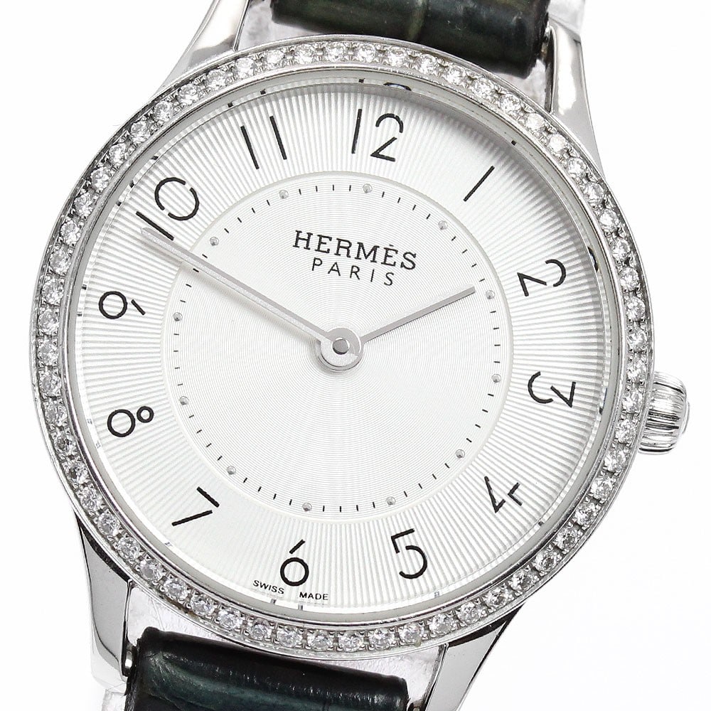Hermes Slim Deux CA2.130 Womens Quartz Watch Diamond Bezel: Hermes Slim Deux CA2.130 Womens Quartz Watch Diamond Bezel Pre-owned Hermes Slim Deux women's wristwatch with a diamond bezel and quartz movement. This Swiss-made watch features a stainless steel case