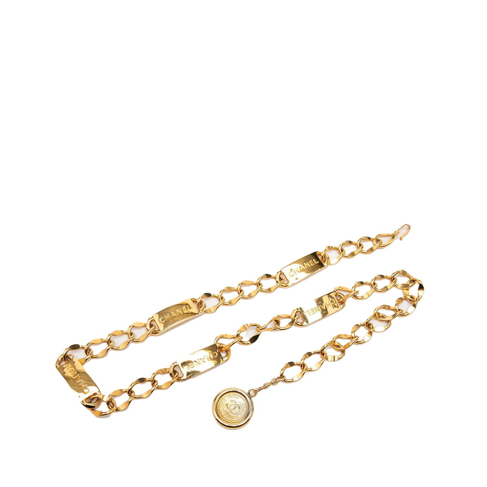 Chanel CC medallion chain belt in gold plated metal: Chanel CC medallion chain belt in gold plated metal Chanel CC chain belt crafted in gold-plated metal with a medallion charm and hook closure. Made in France. Condition is B+ with noted scratches, dis