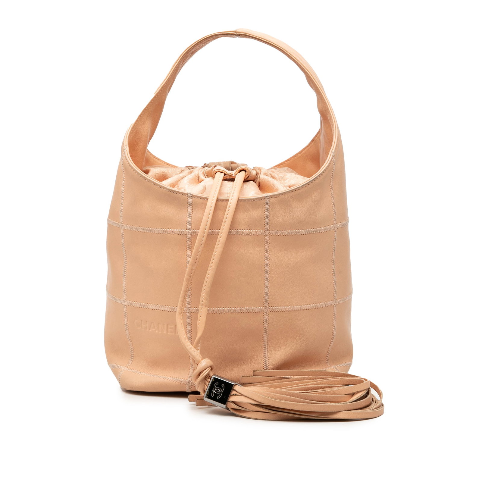 Chanel Square Stitch Tassel Hobo in Beige Calfskin: Chanel Square Stitch Tassel Hobo in Beige Calfskin Chanel Calfskin Square Stitch Tassel Hobo in beige leather with a stitched body, flat top handle, and an open top with drawstring closure and tassel 
