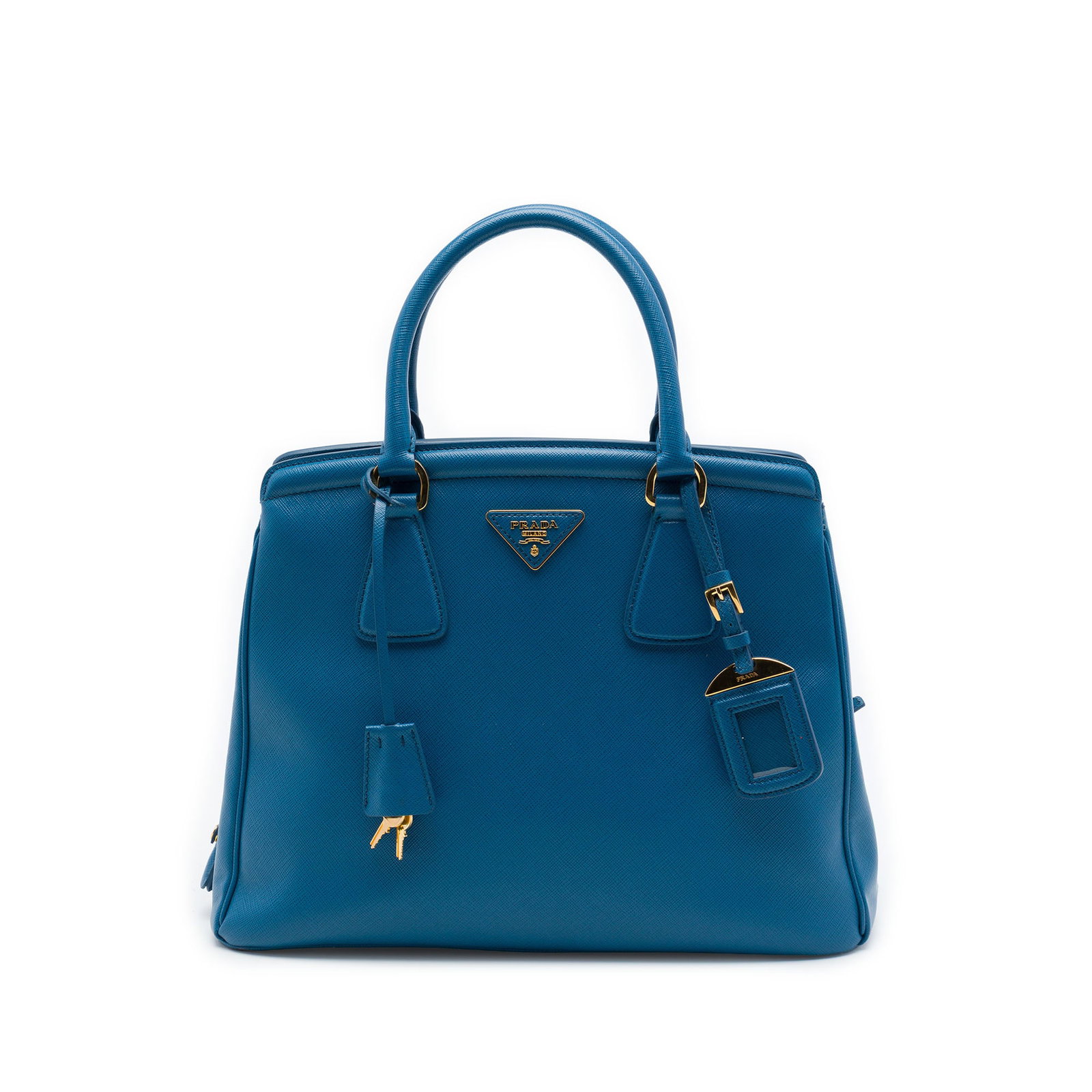 Prada Parabole Tote Blue Leather Saffiano Lux Bag: Prada Parabole Tote Blue Leather Saffiano Lux Bag Prada Saffiano Lux Parabole tote in blue leather with a structured silhouette, rolled handles, clochette, and open top. The interior includes a zip co