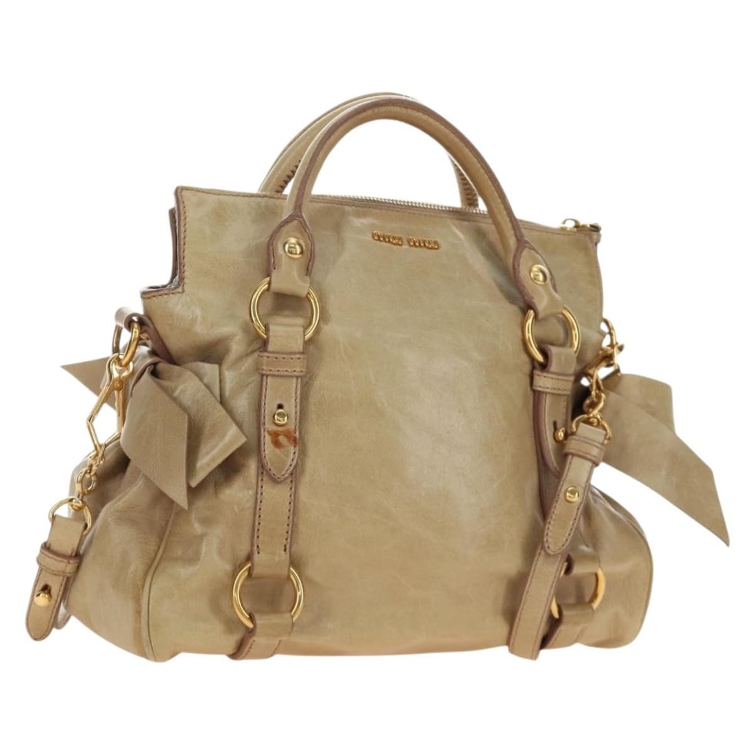 Miu Miu Beige Leather 2way Handbag with Shoulder Strap Dust Bag: Miu Miu Beige Leather 2way Handbag with Shoulder Strap Dust Bag Miu Miu leather hand bag in beige and gold, designed for women and made in Turkey. It comes with a dust bag and shoulder strap. The bag 