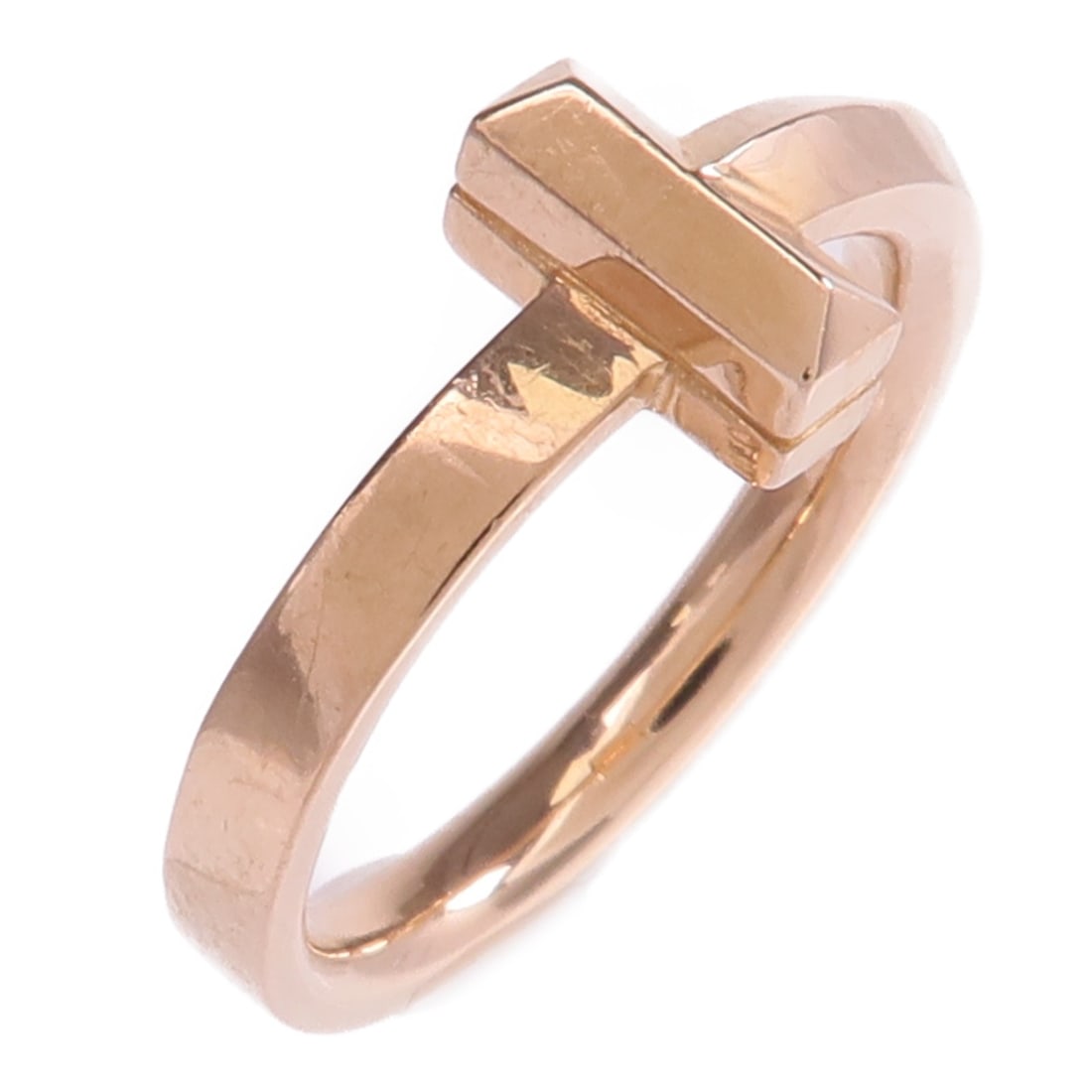 Tiffany and Co T1 18K Rose Gold Ring Size 3.75: Tiffany and Co T1 18K Rose Gold Ring Size 3.75 Tiffany & Co. T1 ring in 18K pink gold, presented in a women's regular size 3.75. The ring has a 2 mm width and weighs 3.9 g. It is described as in very 