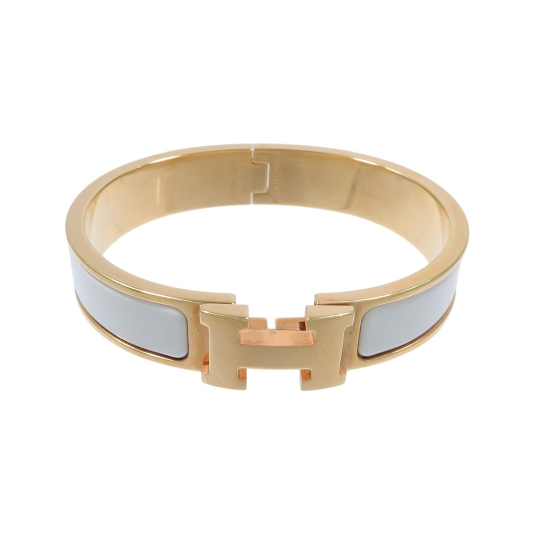 HERMES Clic H enamel bracelet white and gold tone: HERMES Clic H enamel bracelet white and gold tone Hermes Clic H bracelet in white enamel and metal with a white and gold-tone colorway. Designed for women, this bracelet is made in France and includes