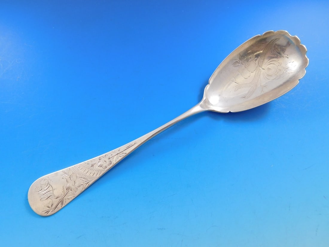 Sterling Silver Brite-Cut Serving Spoon 8 3/8 inches Monogrammed: Sterling Silver Brite-Cut Serving Spoon 8 3/8 inches Monogrammed This exquisite Brite-Cut serving spoon is crafted from high-quality sterling silver, showcasing an elegant ovoid shape and a beautiful 