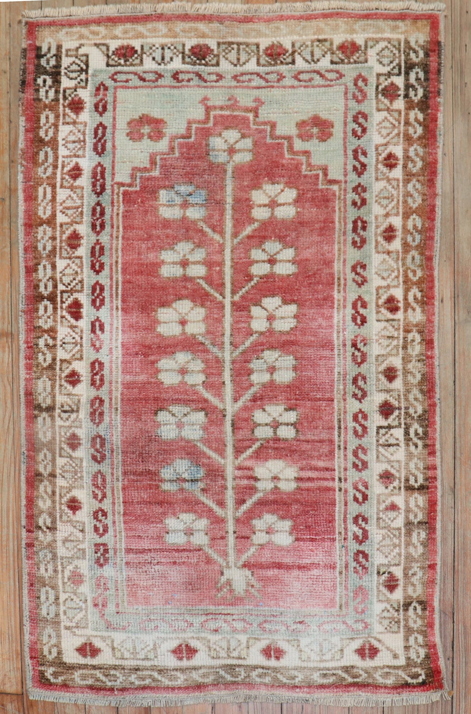 2' 4" x 3' 8" Small Anatolian Rug in Faded Red: 2' 4" x 3' 8" Small Anatolian Rug in Faded Red Pre-owned Turkish Anatolian rug from the 2nd quarter of the 20th century, presented in a faded red tone. This is a small-format rug with a classic Anatol