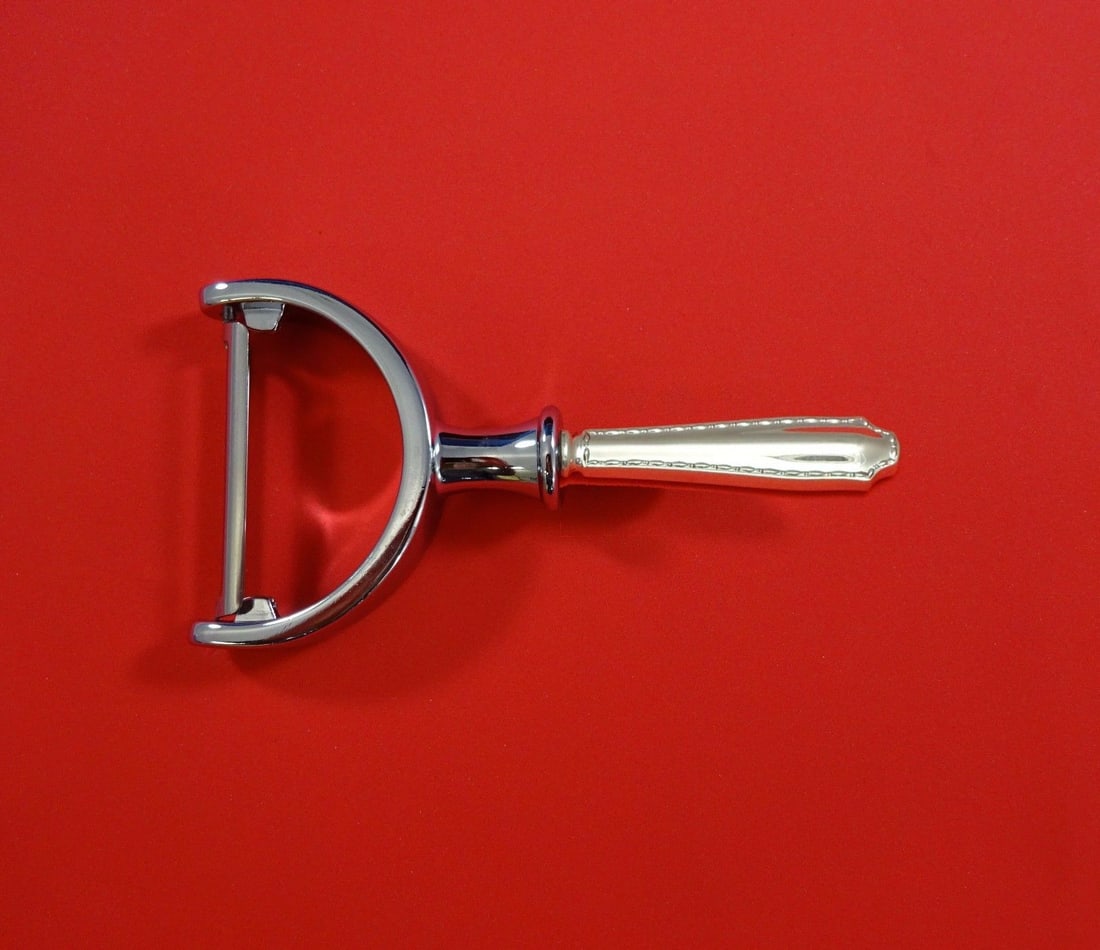 Tiffany & Co. Marquise Sterling Silver Vegetable Peeler Custom Made 6": Tiffany & Co. Marquise Sterling Silver Vegetable Peeler Custom Made 6" Custom-made Marquise pattern vegetable peeler by Tiffany & Co., featuring a sterling silver hollow handle with a stainless steel 