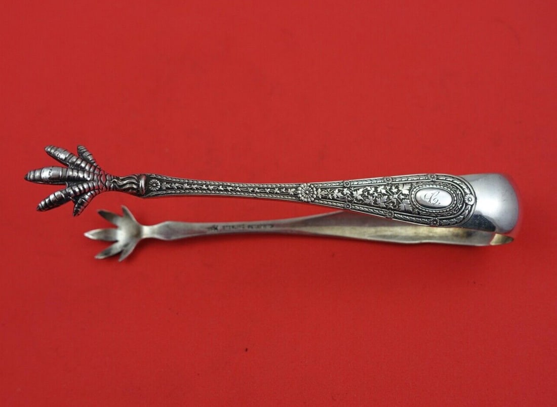 Whiting Laureate Sterling Silver Sugar Tong 5 1/8": Whiting Laureate Sterling Silver Sugar Tong 5 1/8" Sterling silver sugar tong in the Laureate pattern by Whiting. This serving piece measures 5 1/8 inches and is monogrammed, with monos varying. It is