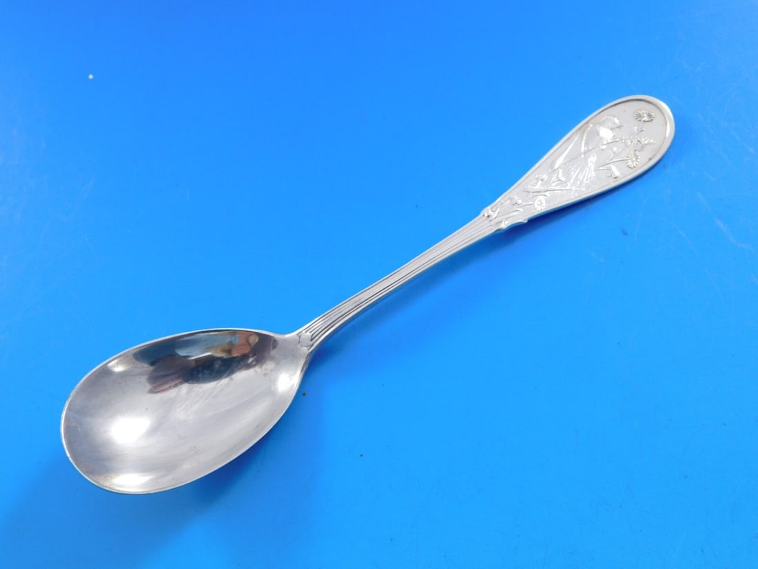 Tiffany & Co Japanese Sterling Silver Egg Spoon Multi-Motif 4 3/4 Inch: Tiffany & Co Japanese Sterling Silver Egg Spoon Multi-Motif 4 3/4 Inch This exquisite egg spoon, crafted by Tiffany & Co., is a stunning example of sterling silver artistry. Measuring 4 3/4 inches, it