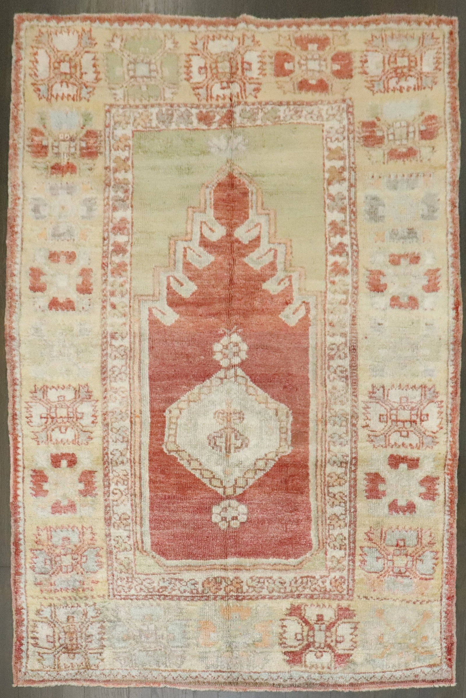 3' 9" x 5' 2" Anatolian Oushak Prayer Niche Rug: 3' 9" x 5' 2" Anatolian Oushak Prayer Niche Rug One-of-a-kind antique Turkish Oushak prayer rug featuring a prayer niche design from the early 20th century. This pre-owned Anatolian rug reflects the c