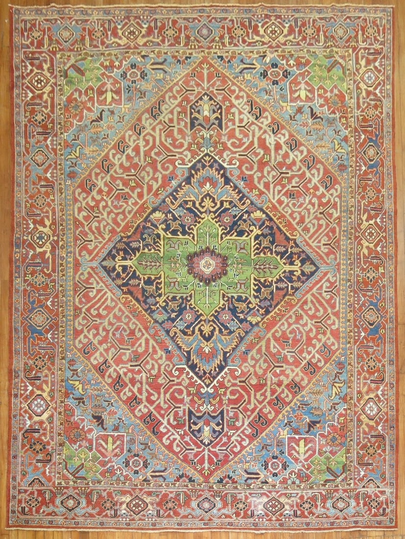 8' 7" x 11' 6" Early 20th Century Persian Heriz Rug: 8' 7" x 11' 6" Early 20th Century Persian Heriz Rug Early 20th century Persian Heriz rug with a colorful geometric design. This pre-owned room-size rug is identified as a Serapi/Heriz type. Specificat