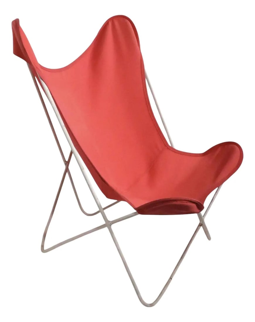 Mid Century Butterfly Chair Orange Sling White Wrought Iron Frame: Mid Century Butterfly Chair Orange Sling White Wrought Iron Frame This classic Mid Century Butterfly Chair features a vibrant orange fabric sling supported by a sturdy white wrought iron frame. A quin