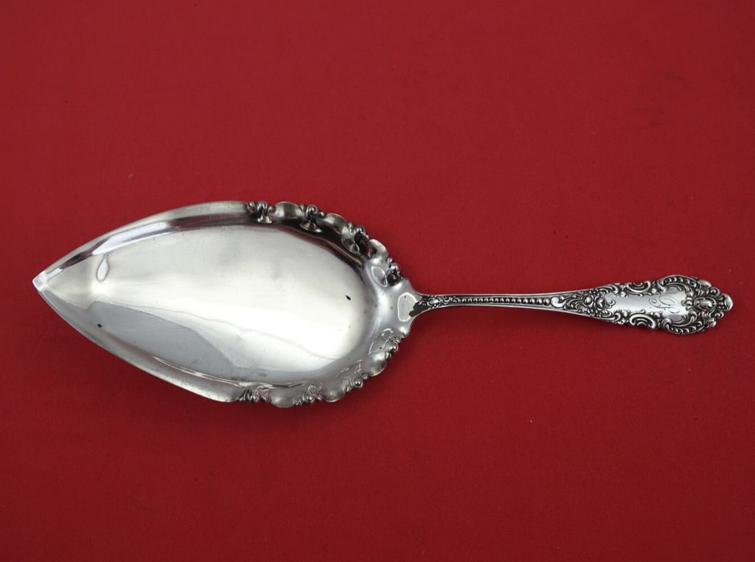 Knowles Mauser Apollo Sterling Silver Ruffled Pie Server 8": Knowles Mauser Apollo Sterling Silver Ruffled Pie Server 8" Serve your favorite desserts with elegance using this 8" pie server from the Apollo pattern by Knowles and Mauser. Crafted entirely from ste