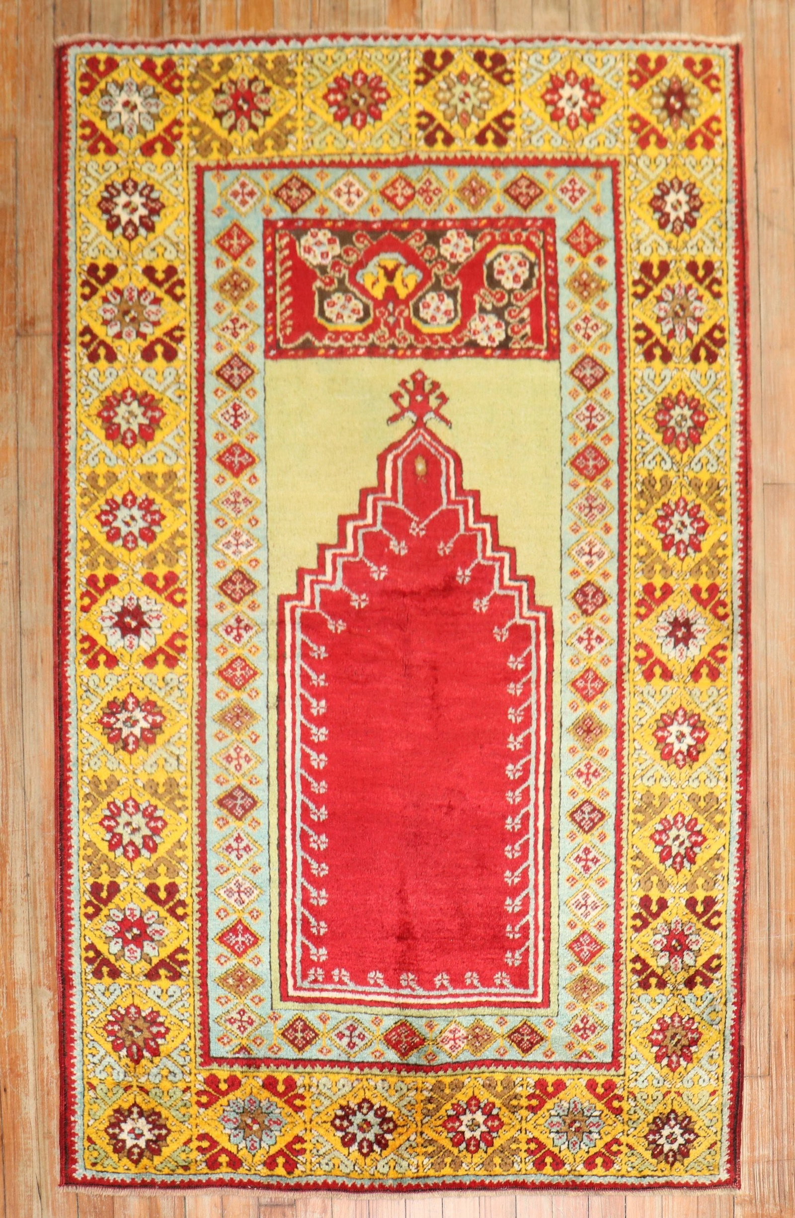 3' 7" x 5' 6" Mudjur Oushak Turkish prayer rug: 3' 7" x 5' 6" Mudjur Oushak Turkish prayer rug Early 20th century Turkish prayer rug featuring a colorful design with a prayer niche motif. Identified as a Mudjur, Oushak type, this small pre-owned ru