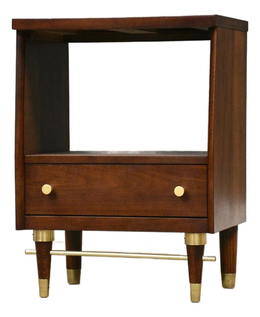 1960s Walnut Mid Century Nightstand with Brass Accents: 1960s Walnut Mid Century Nightstand with Brass Accents This refined mid-century modern nightstand features a single drawer crafted from walnut, enhanced by elegant brass accents and knobs. Professiona