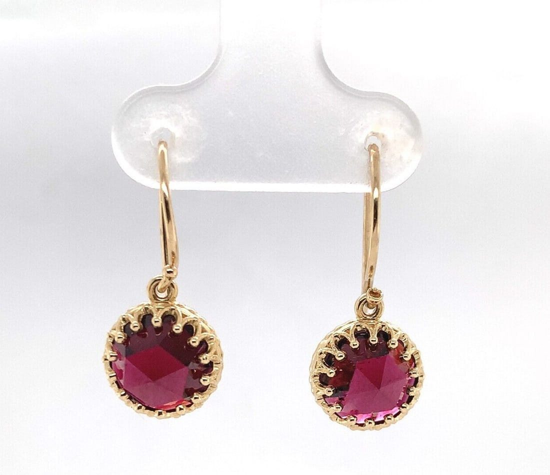 14k Yellow Gold Dangle Earrings with Natural Rose Cut Garnets: 14k Yellow Gold Dangle Earrings with Natural Rose Cut Garnets These stunning 14k yellow gold dangle drop earrings feature genuine natural garnets in a rose cut. Each earring showcases a round garnet w