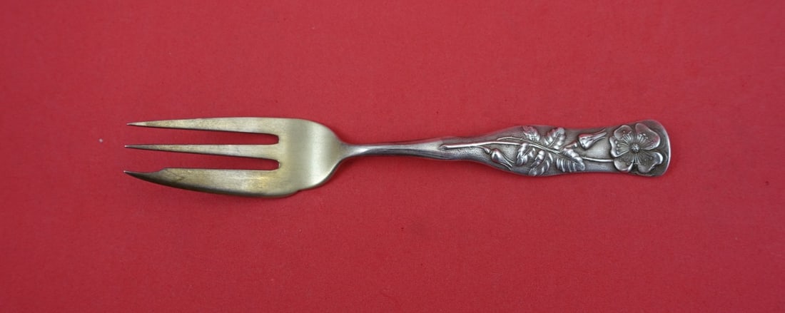 Sterling silver pastry fork Flora pattern gold washed 3-tine wild rose 5 7/8 inch: Sterling silver pastry fork Flora pattern gold washed 3-tine wild rose 5 7/8 inch This is a Shiebler Flora pattern sterling silver pastry fork featuring a gold-washed 3-tine design with a wild rose mo