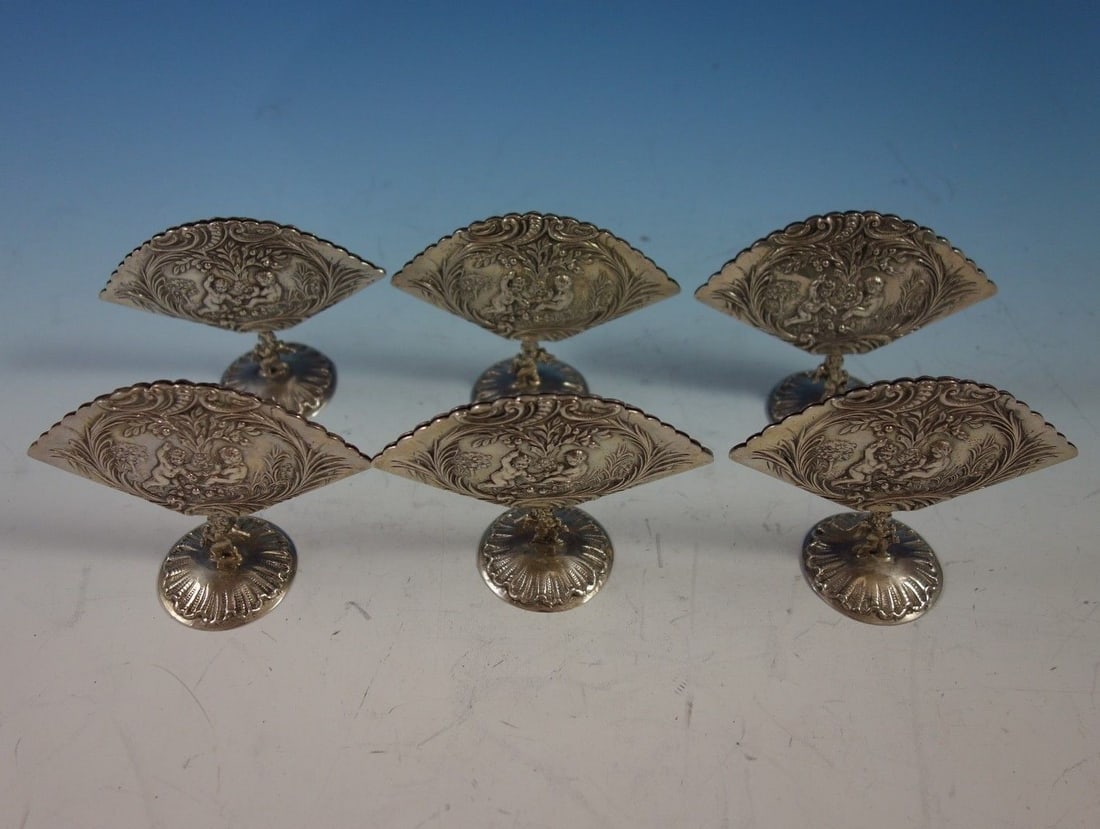 J. Kurz & Co. 6-Piece .800 Silver Menu Holders with Repoussed Cupids: J. Kurz & Co. 6-Piece .800 Silver Menu Holders with Repoussed Cupids Enhance your dining experience with this exquisite 6-piece set of menu holders from J. Kurz & Co. Crafted from .800 silver, these