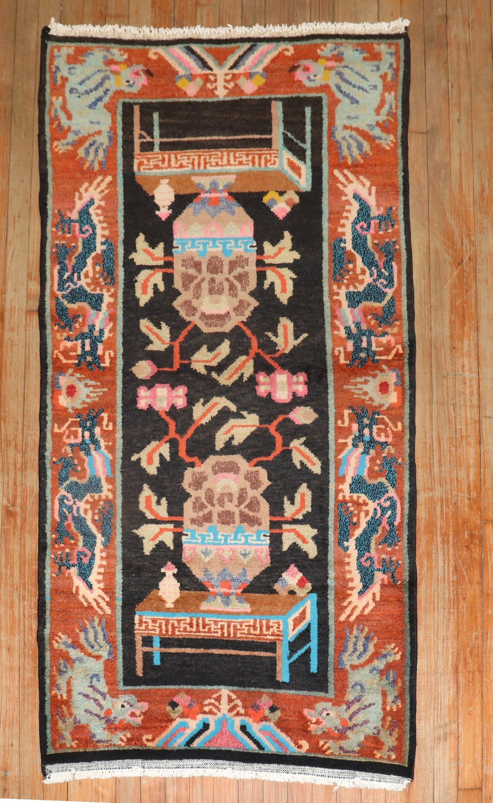 3' x 5' 8" Small Tibetan Rug Colorful Floral Design: 3' x 5' 8" Small Tibetan Rug Colorful Floral Design Late 20th century Tibetan rug featuring a colorful, quirky design. This pre-owned small area rug offers a vibrant decorative look with a central flo