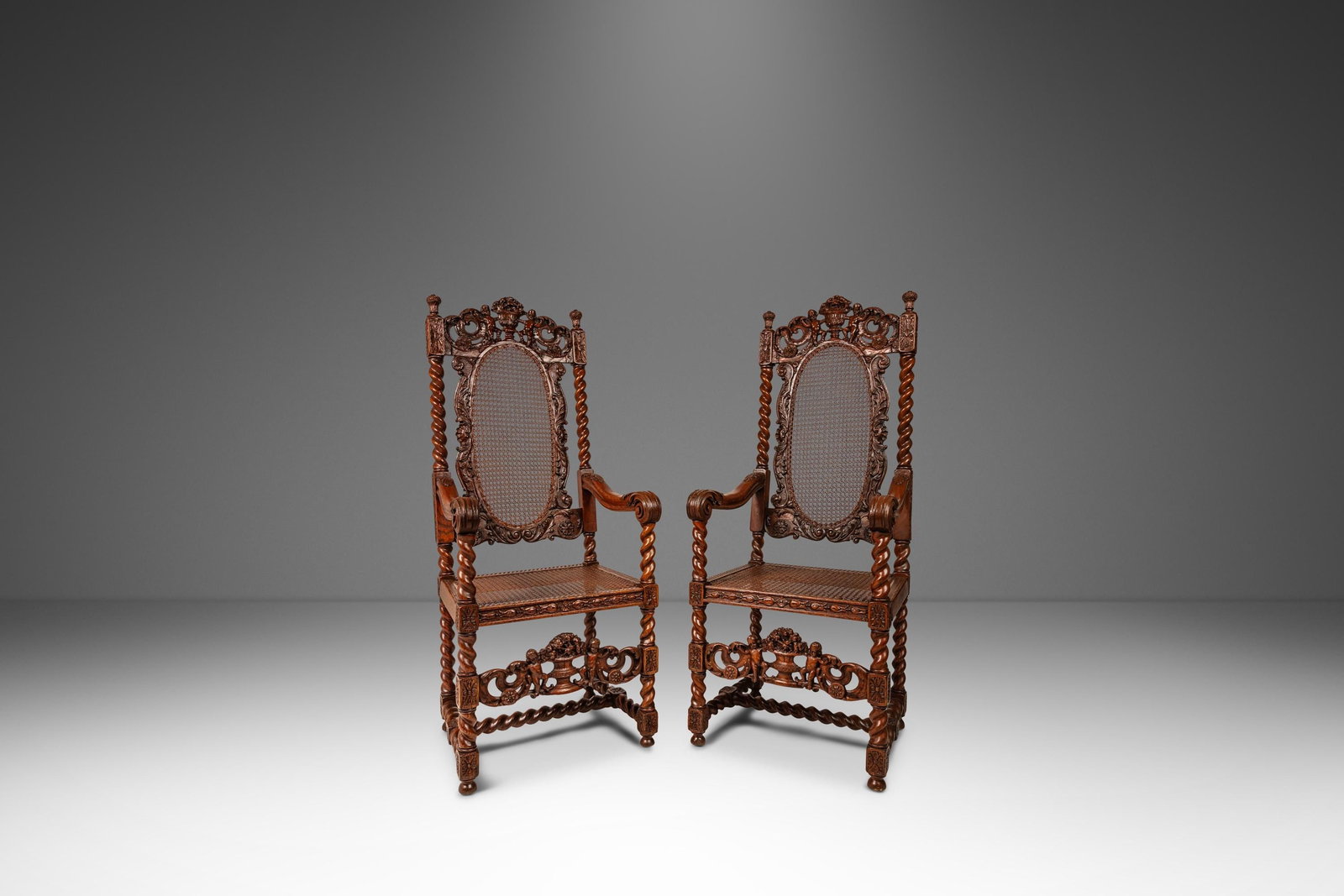 Antique 18th Century Set of 2 Jacobean Baroque Armchairs Oak Cane England: Antique 18th Century Set of 2 Jacobean Baroque Armchairs Oak Cane England This exquisite set of two antique armchairs showcases the remarkable craftsmanship of the 18th-century Jacobean Stuart/Baroque