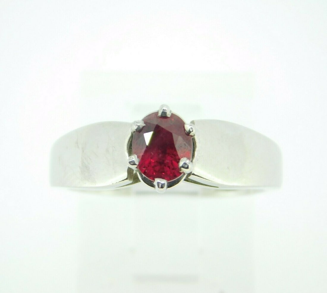 Stunning 1.10ct Oval Natural Ruby Platinum Solitaire Ring: Stunning 1.10ct Oval Natural Ruby Platinum Solitaire Ring This captivating platinum ring features a stunning 1.10ct genuine natural ruby, elegantly set in a classic prong setting. The oval-shaped ruby