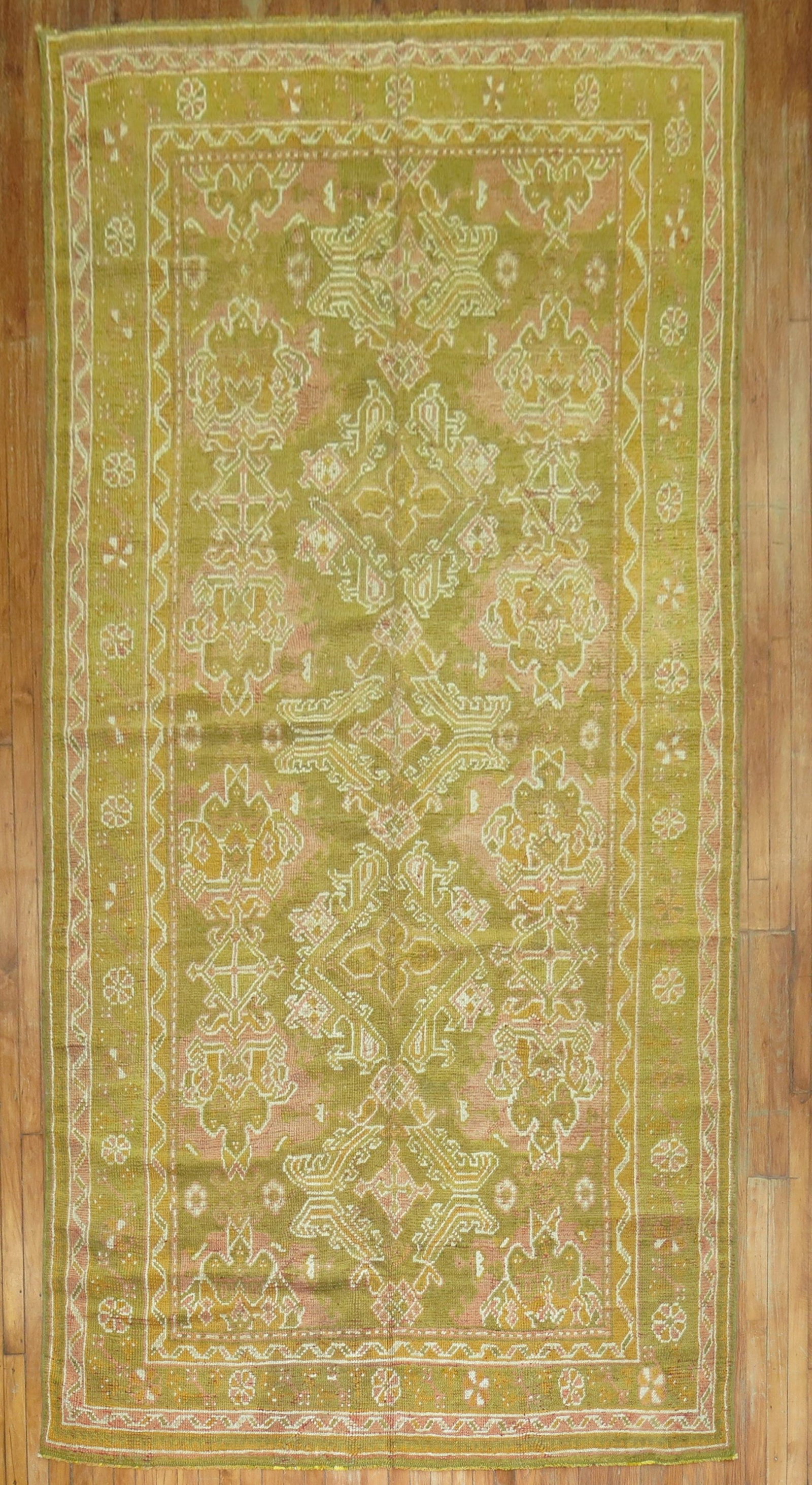 6' 3" x 12' 6" Early 20th Century Green Oushak Gallery Rug: 6' 3" x 12' 6" Early 20th Century Green Oushak Gallery Rug Early 20th century Oushak gallery rug in a rare gallery size. This pre-owned rug features a green field with intricate geometric patterning a
