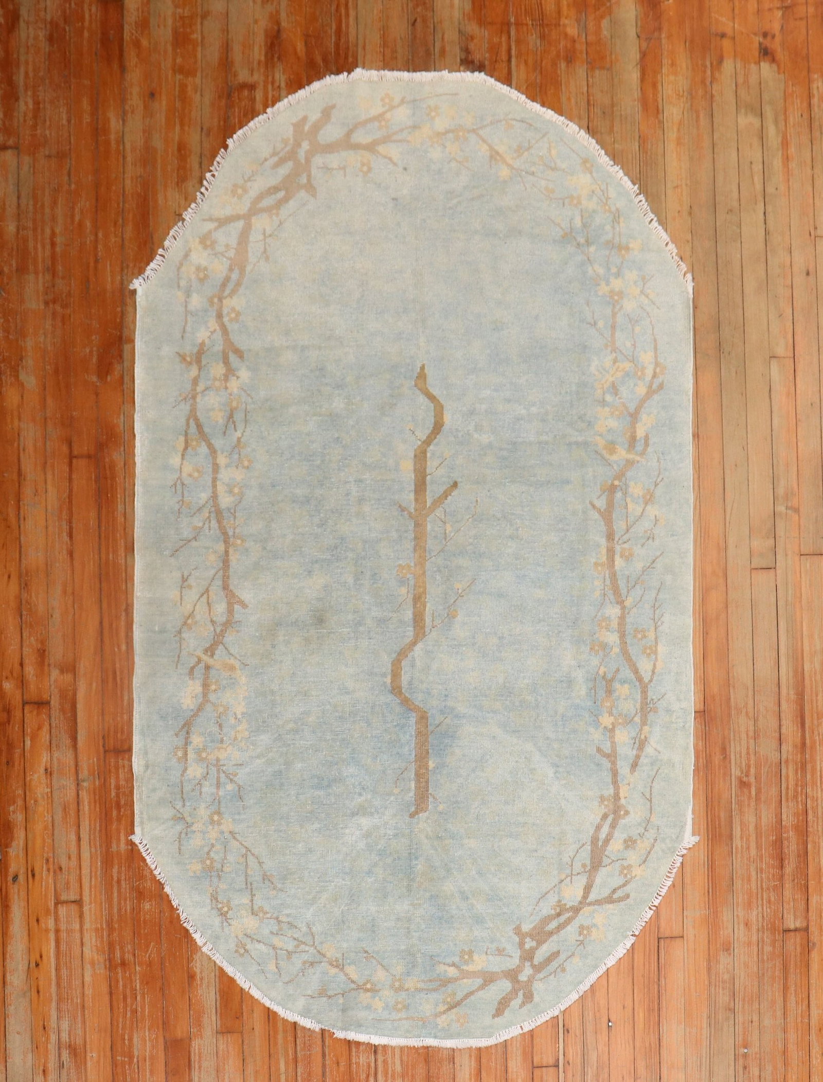 4' x 7' Oval Chinese Accent Rug in Powder Blue: 4' x 7' Oval Chinese Accent Rug in Powder Blue Early 20th-century Chinese accent rug in a powder blue colorway with an oval shape. This pre-owned piece shows wear consistent with age and use. Specific