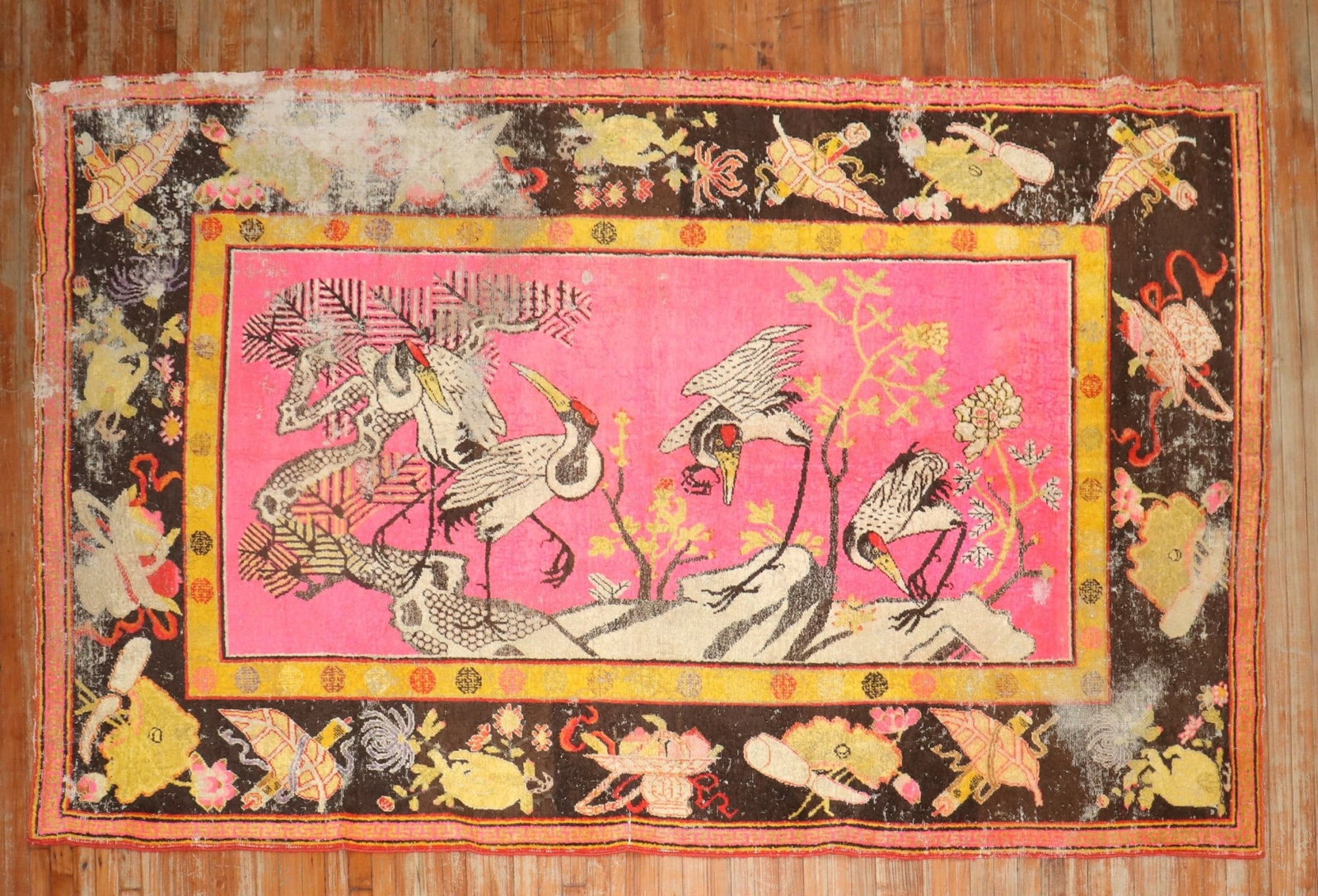 5' 10" x 10' Antique Khotan Samarkand Pictorial Rug with Flamingos: 5' 10" x 10' Antique Khotan Samarkand Pictorial Rug with Flamingos Late 19th century distressed antique Samarkand Khotan pictorial rug featuring 4 flamingos hovering over a bright pink ground. This pr