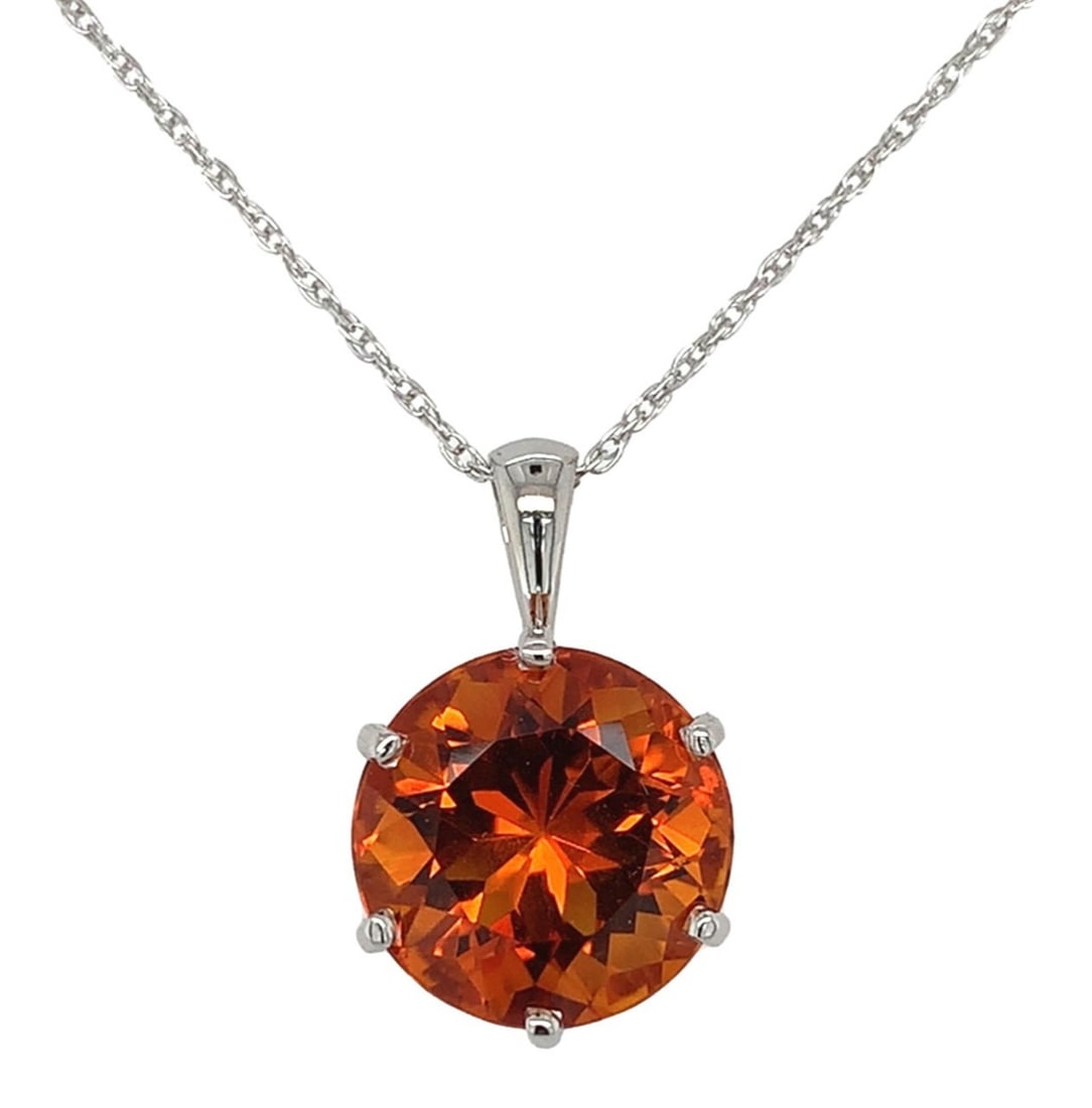 Platinum 6.43ct Round Brilliant Cut Orange Citrine Pendant with Chain: Platinum 6.43ct Round Brilliant Cut Orange Citrine Pendant with Chain This exquisite pendant features a stunning 6.43 carat round brilliant cut citrine, showcasing a vibrant orange hue sourced from th