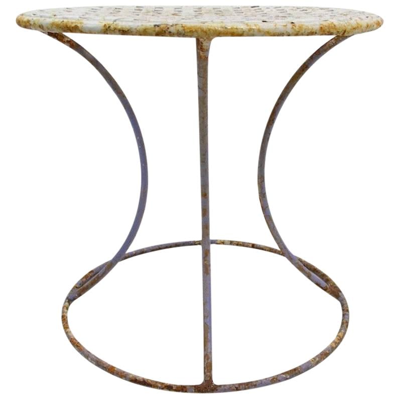 Elegant Wrought Iron Side Table by Woodard with Weave Top: Elegant Wrought Iron Side Table by Woodard with Weave Top This stylish wrought iron side table features a distinctive weave pattern top and a sleek waisted form base. It is finished in an old paint, m