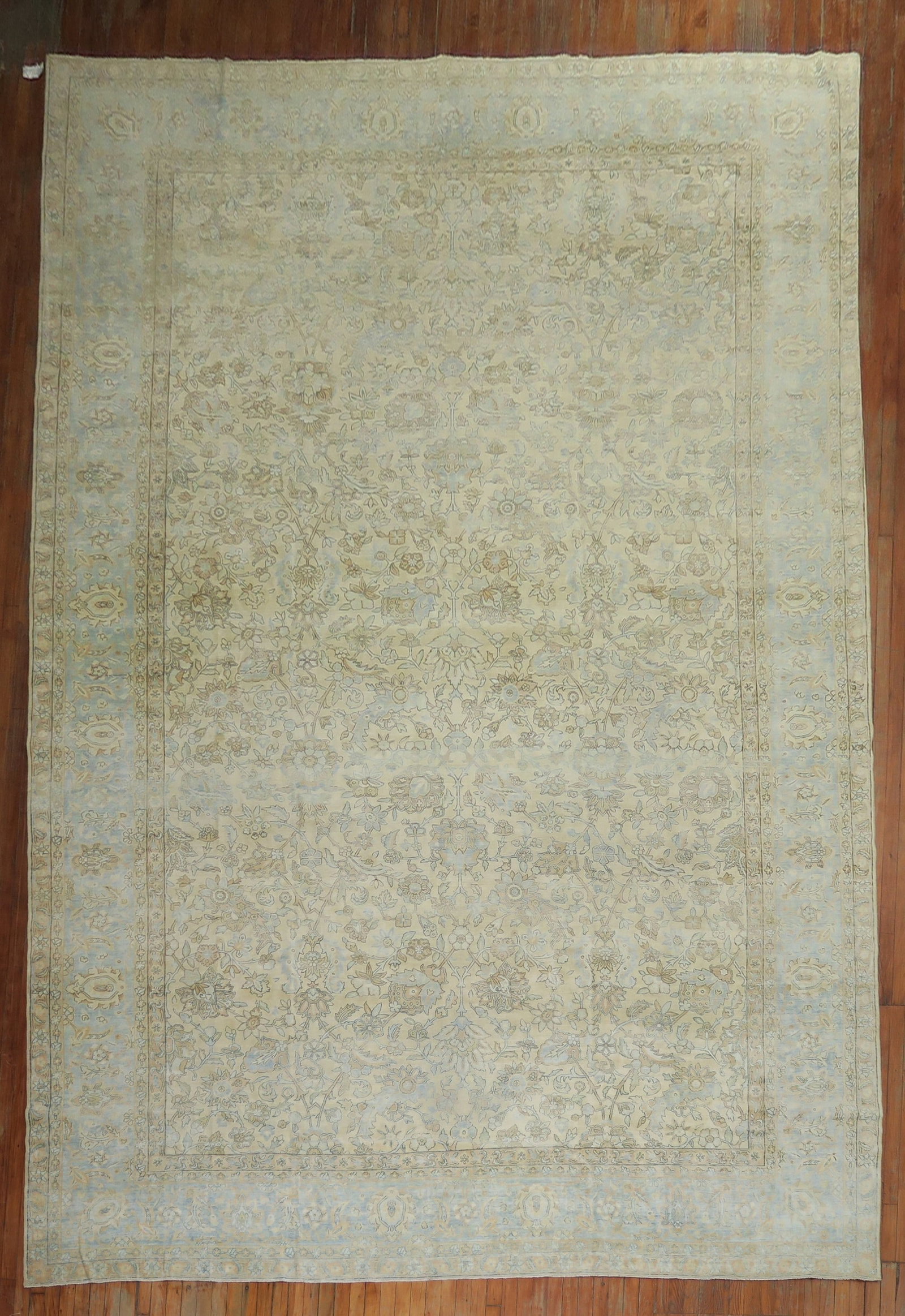 10' 10" x 17' 6" Antique Persian Floral Rug Beige Blue Brown: 10' 10" x 17' 6" Antique Persian Floral Rug Beige Blue Brown Oversize antique Persian rug featuring an all-over traditional floral motif in light blue, beige, khaki, and brown tones. Pre-owned and in 