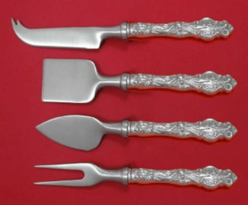 Irian by Wallace Sterling Silver 4pc Cheese Serving Set Art Nouveau: Irian by Wallace Sterling Silver 4pc Cheese Serving Set Art Nouveau Enhance your entertaining experience with the exquisite Irian by Wallace Sterling Silver Cheese Serving Set. This 4-piece hostess se