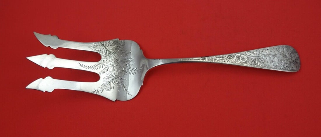 John Vansant Brite-Cut Sterling Silver Salad Serving Fork 10 1/2": John Vansant Brite-Cut Sterling Silver Salad Serving Fork 10 1/2" This exquisite salad serving fork is crafted from sterling silver by renowned maker John Vansant. Featuring the elegant Brite-Cut patt