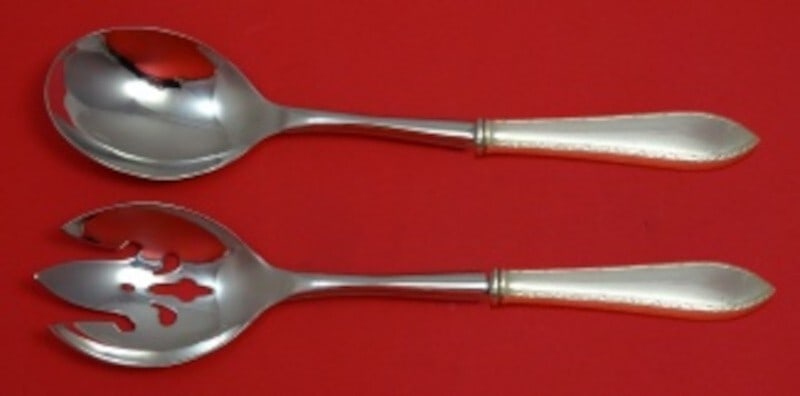Tiffany & Co Feather Edge Sterling Silver Salad Serving Set 2pc: Tiffany & Co Feather Edge Sterling Silver Salad Serving Set 2pc Elevate your dining experience with this exquisite 2-piece Salad Serving Set from Tiffany & Co., featuring the elegant Feather Edge patt