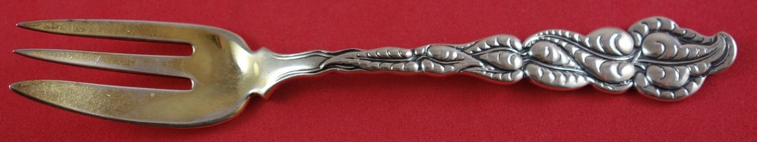 Tiffany and Co Ailanthus Sterling Silver Caviar Fork Goldwashed 5 3/4": Tiffany and Co Ailanthus Sterling Silver Caviar Fork Goldwashed 5 3/4" Sterling silver caviar fork in the Ailanthus pattern by Tiffany and Co. It features a goldwashed finish, measures 5 3/4 inches, a
