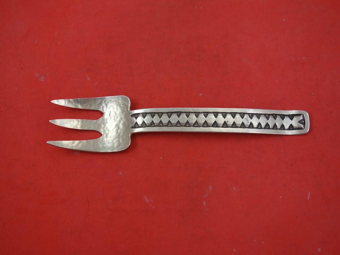 James Fox Indigenous Sterling Silver Hand Wrought Cold Meat Fork 8 3/4": James Fox Indigenous Sterling Silver Hand Wrought Cold Meat Fork 8 3/4" This exquisite serving fork is a stunning piece of Native American craftsmanship. Hand wrought and hammered from sterling silver