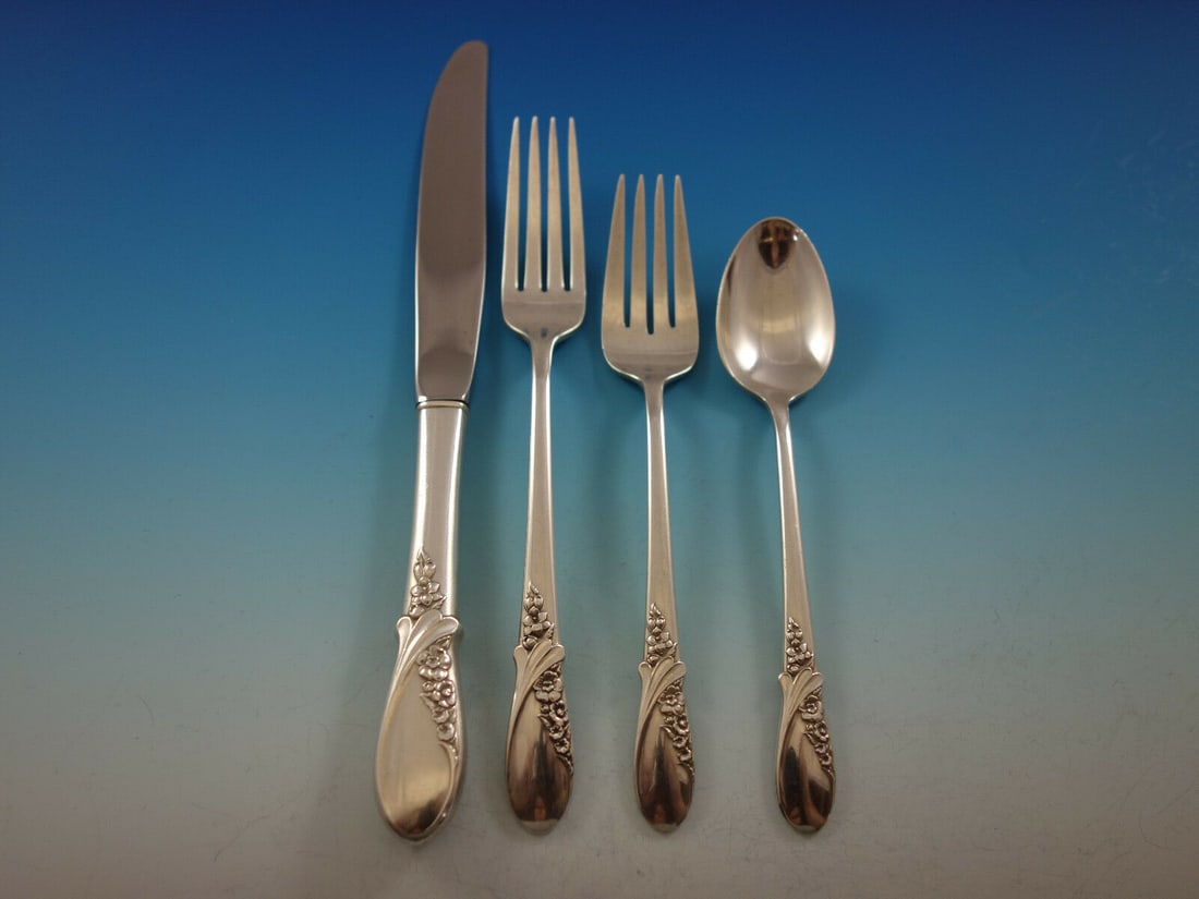 May Melody International Sterling Silver 4-Piece Place Setting: May Melody International Sterling Silver 4-Piece Place Setting Enhance your dining experience with the exquisite May Melody place setting by International Sterling. This elegant 4-piece set features a