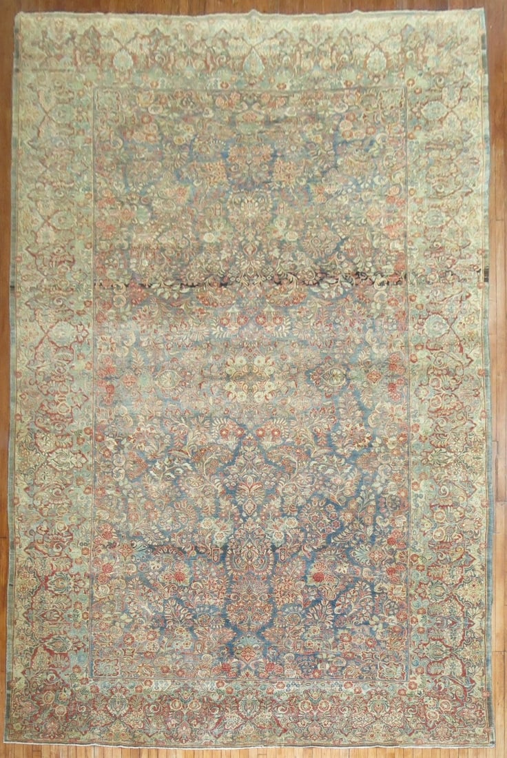 10' 3" x 17' 5" Oversize Persian Sarouk Rug Blue: 10' 3" x 17' 5" Oversize Persian Sarouk Rug Blue Early 20th century Persian Sarouk oversize rug in a formal blue design. This pre-owned rug is identified as a Sarouk and offers the classic character a